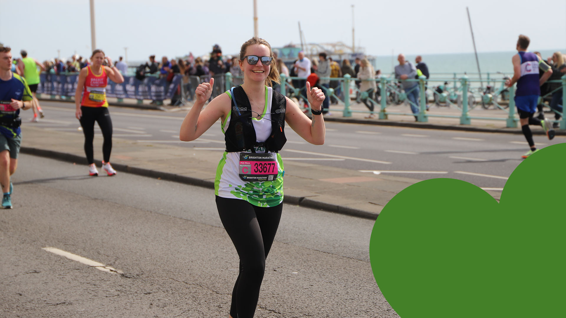 Smiling St Peter & St James Hospice runner with green heart overlaid