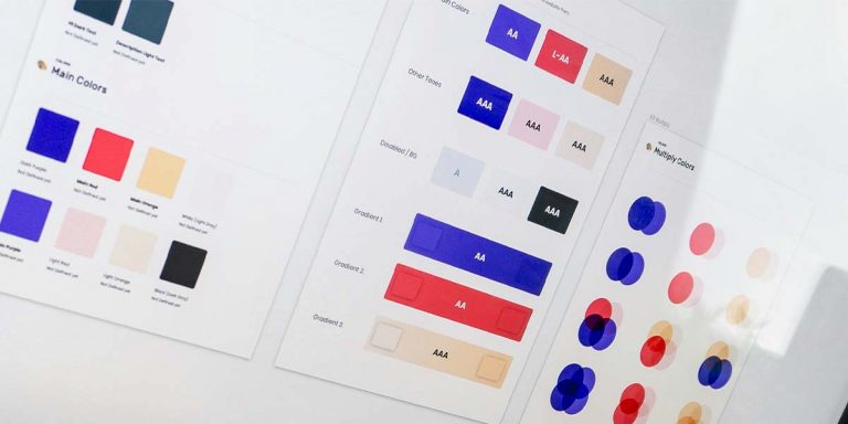 Photo of computer screen with logo and brand colours